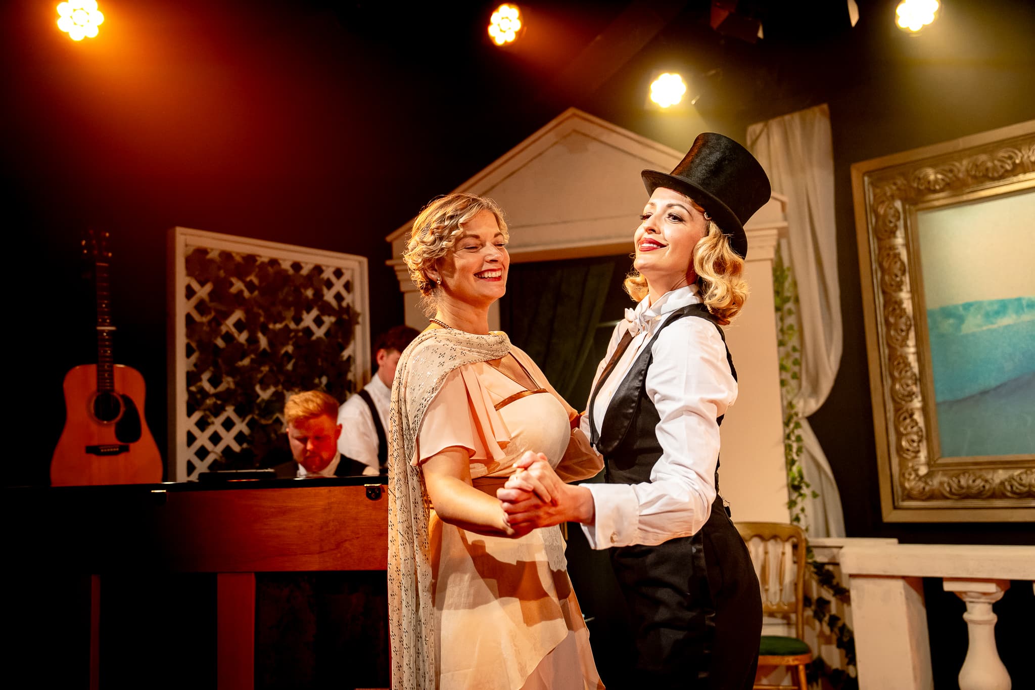 Two performers dancing together during Extraordinary Women