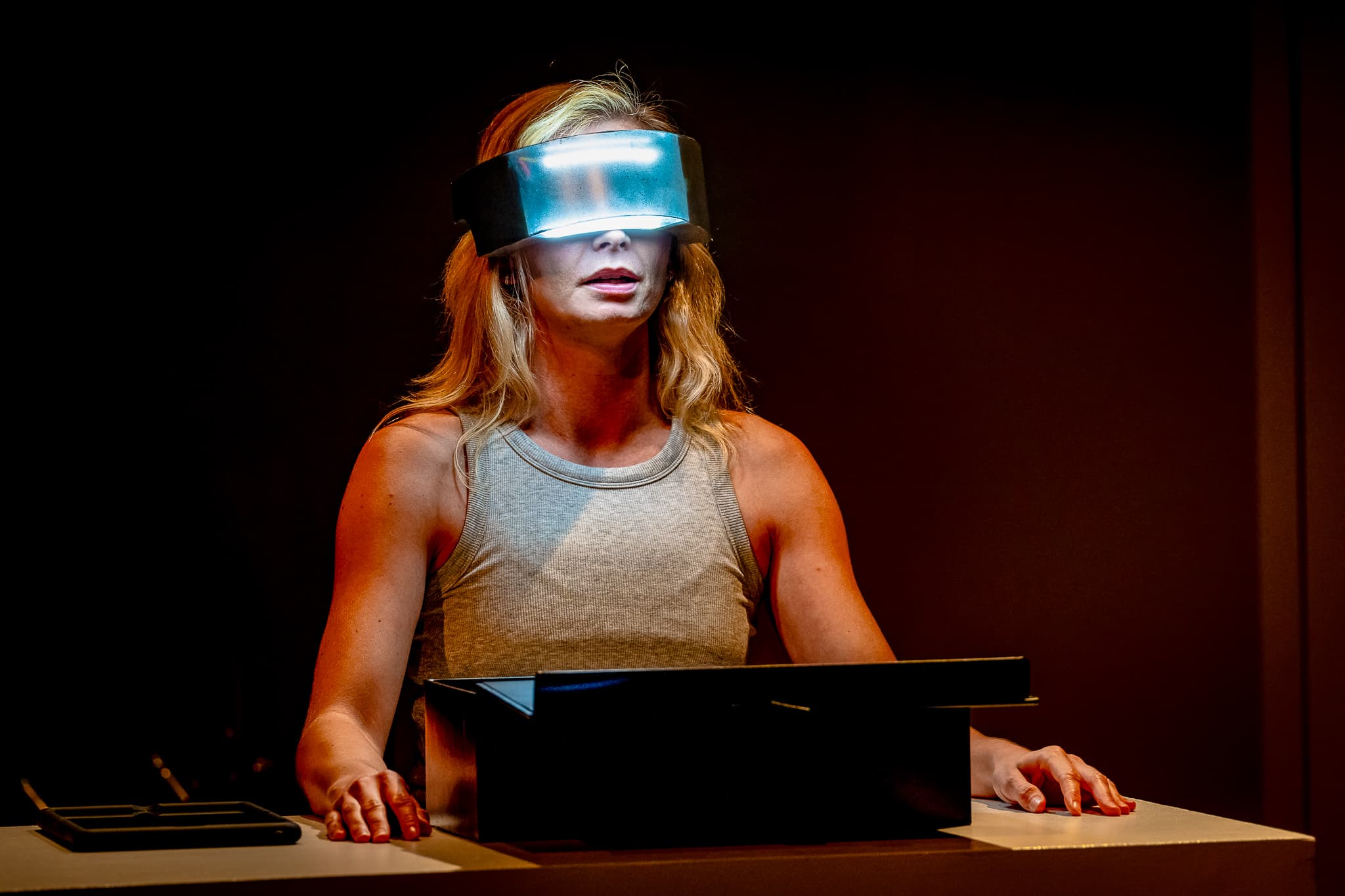 A performer wearing an illuminated digital visor