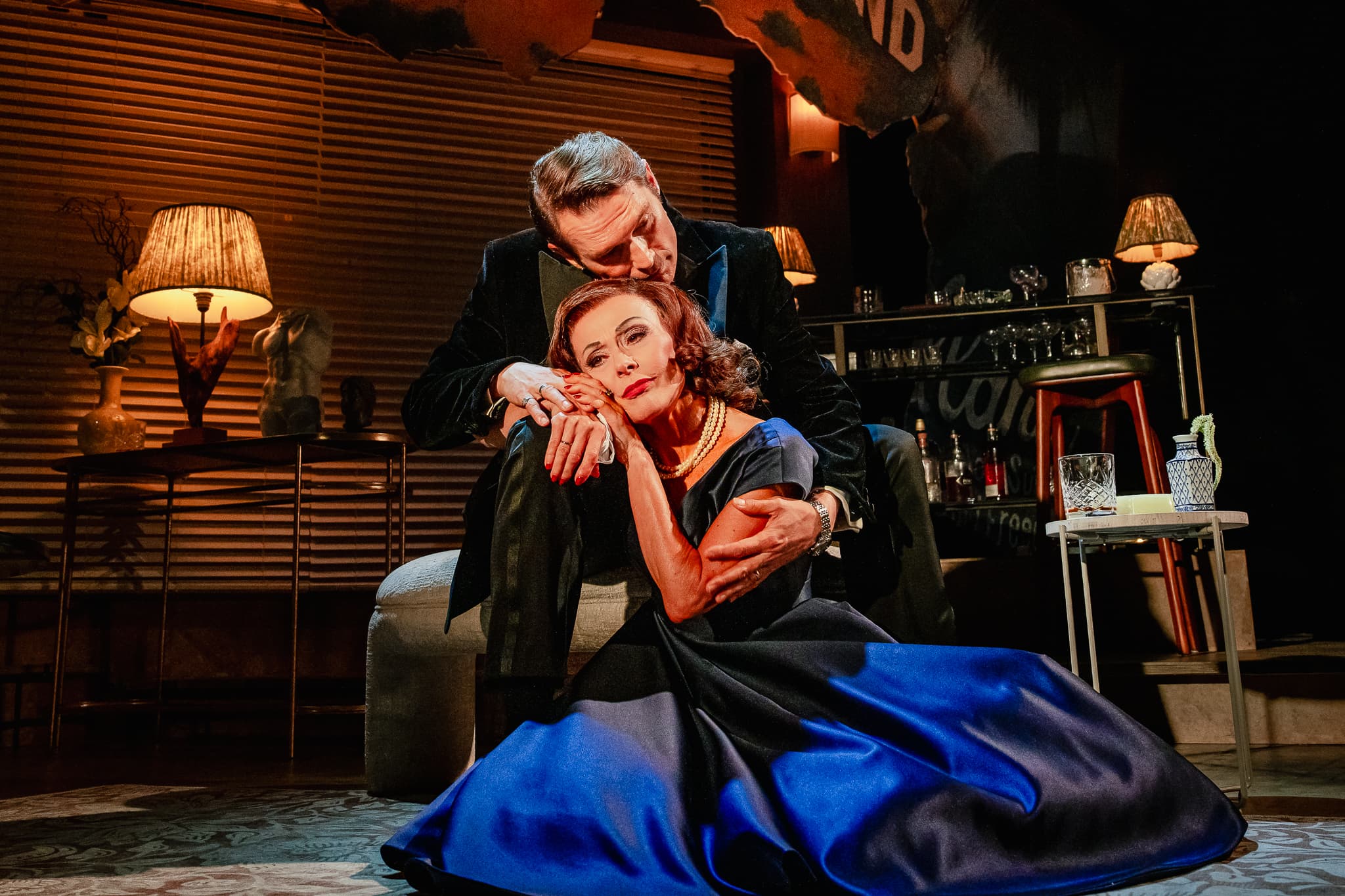 Two performers sharing an intimate moment in The Code